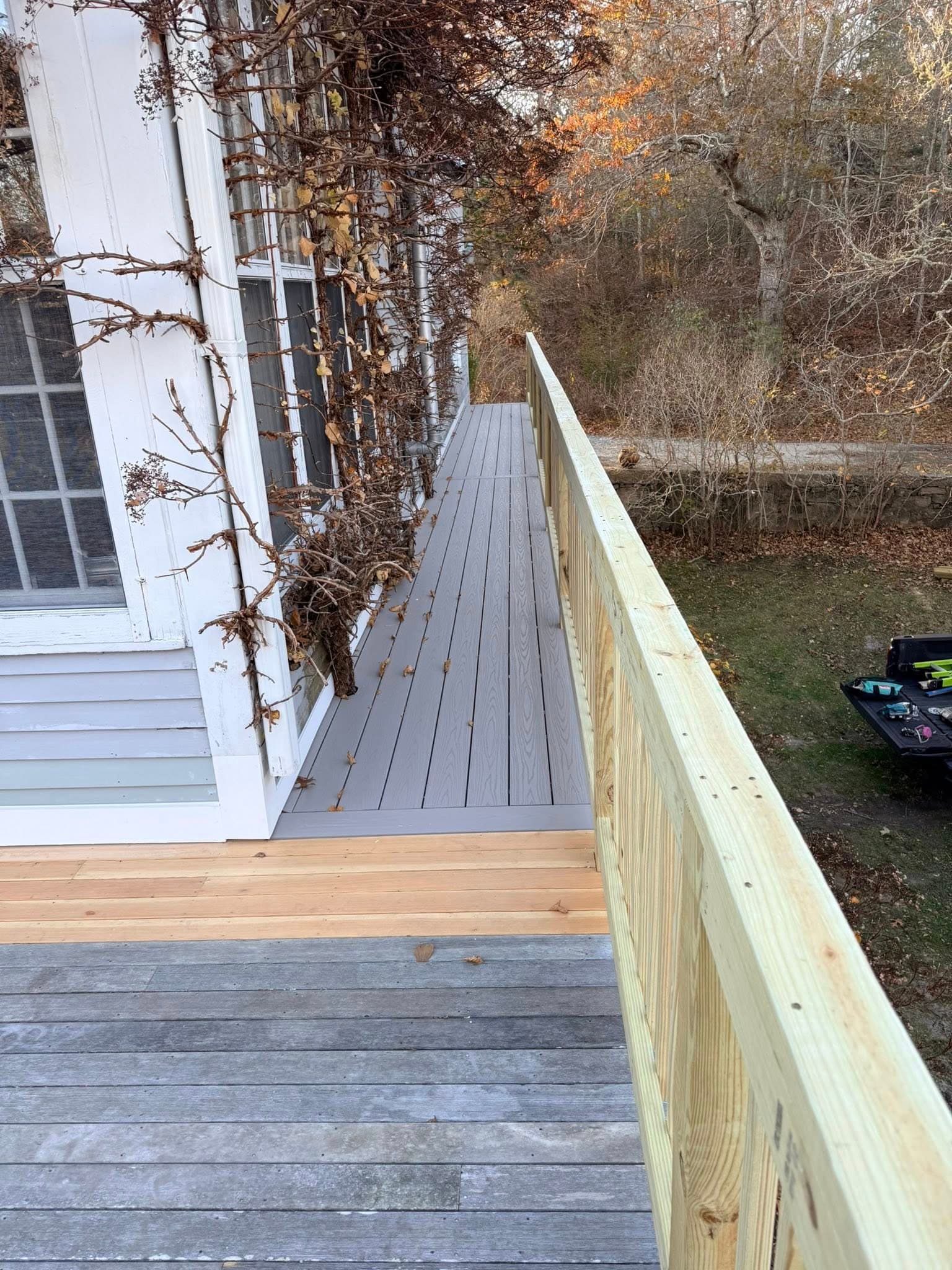Composite deck walkway along the side of the home