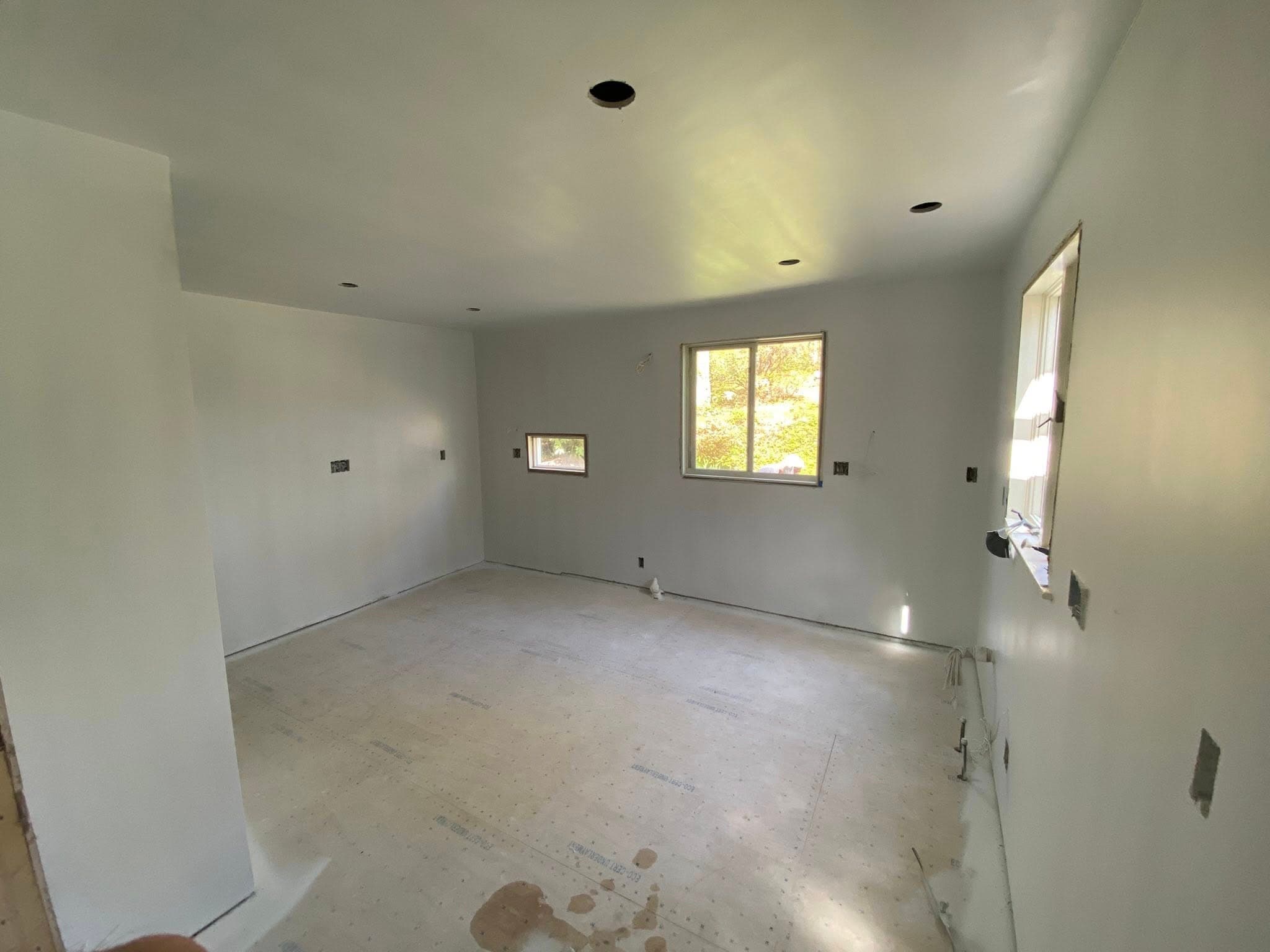 Finished interior room with fresh paint and flooring