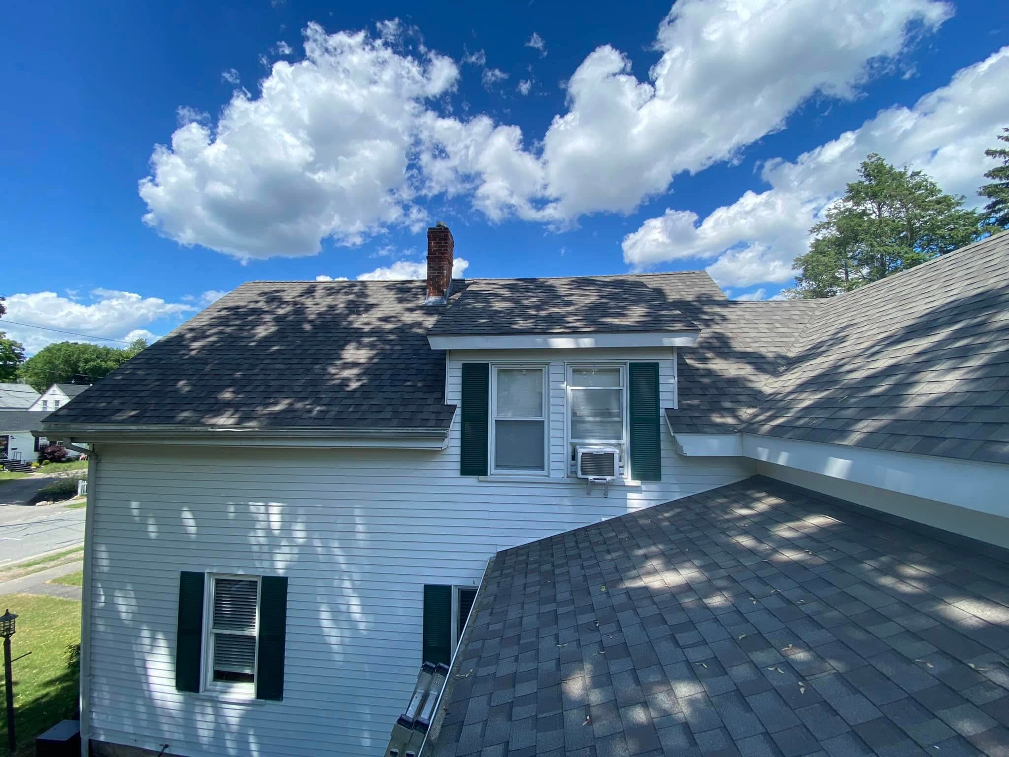 Home with completed new asphalt roof