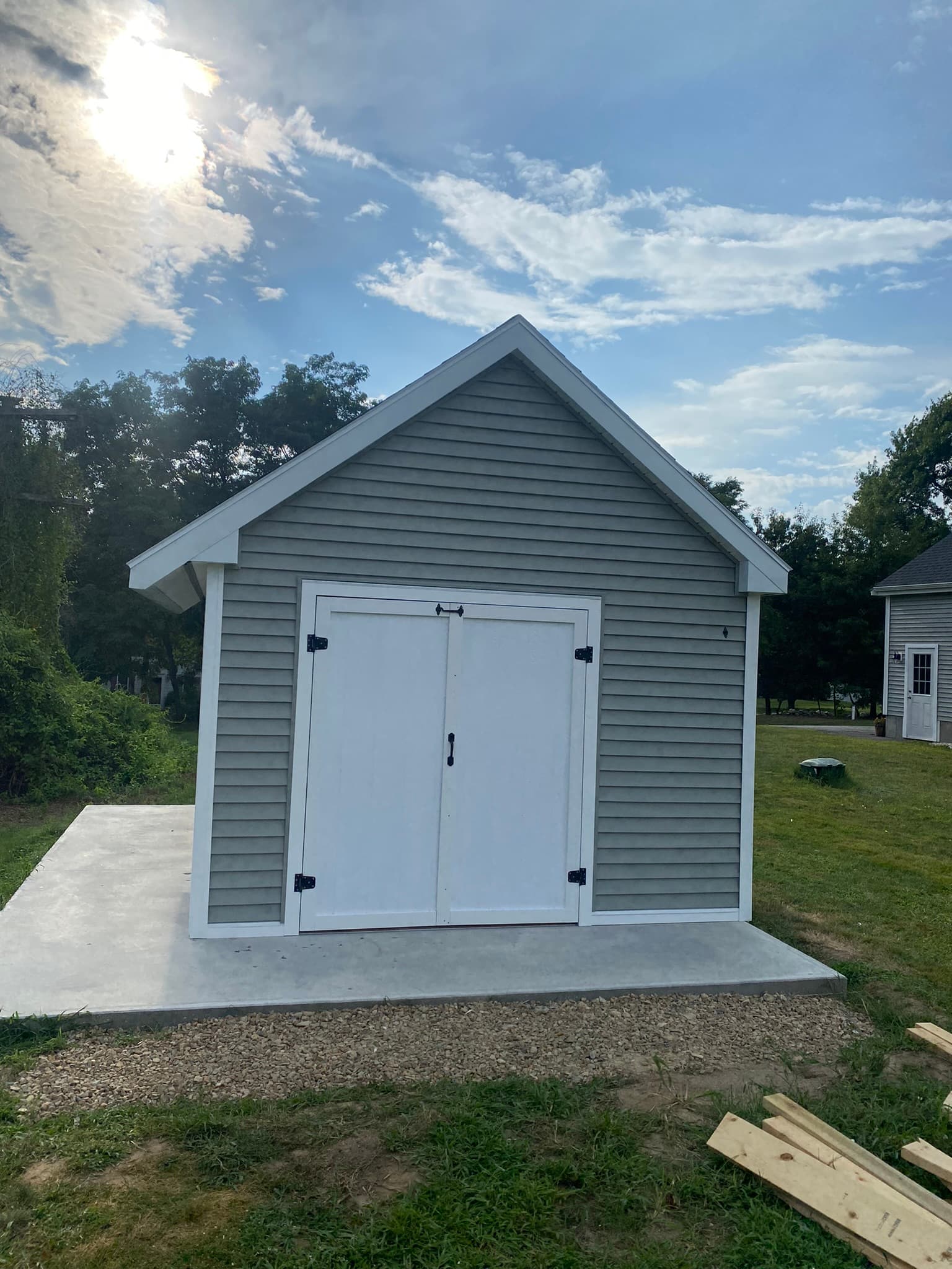 Finished shed front with white barn doors