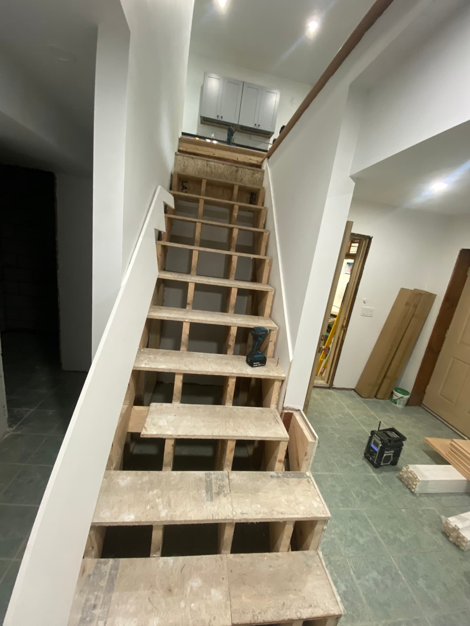 Exposed staircase stringers before treads were installed